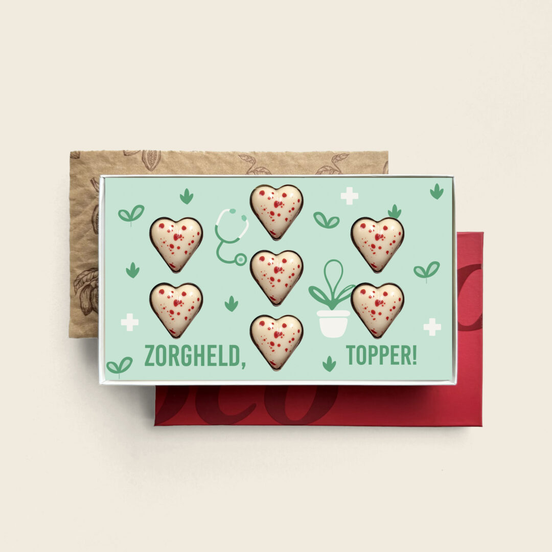 Weiße Herzen mit roten Punkten Pralinen mit köstlicher Füllung zum Thema „Tag der Pflege“ Pflegeheld-Topper. Tasty Present – personalisierte Schokolade