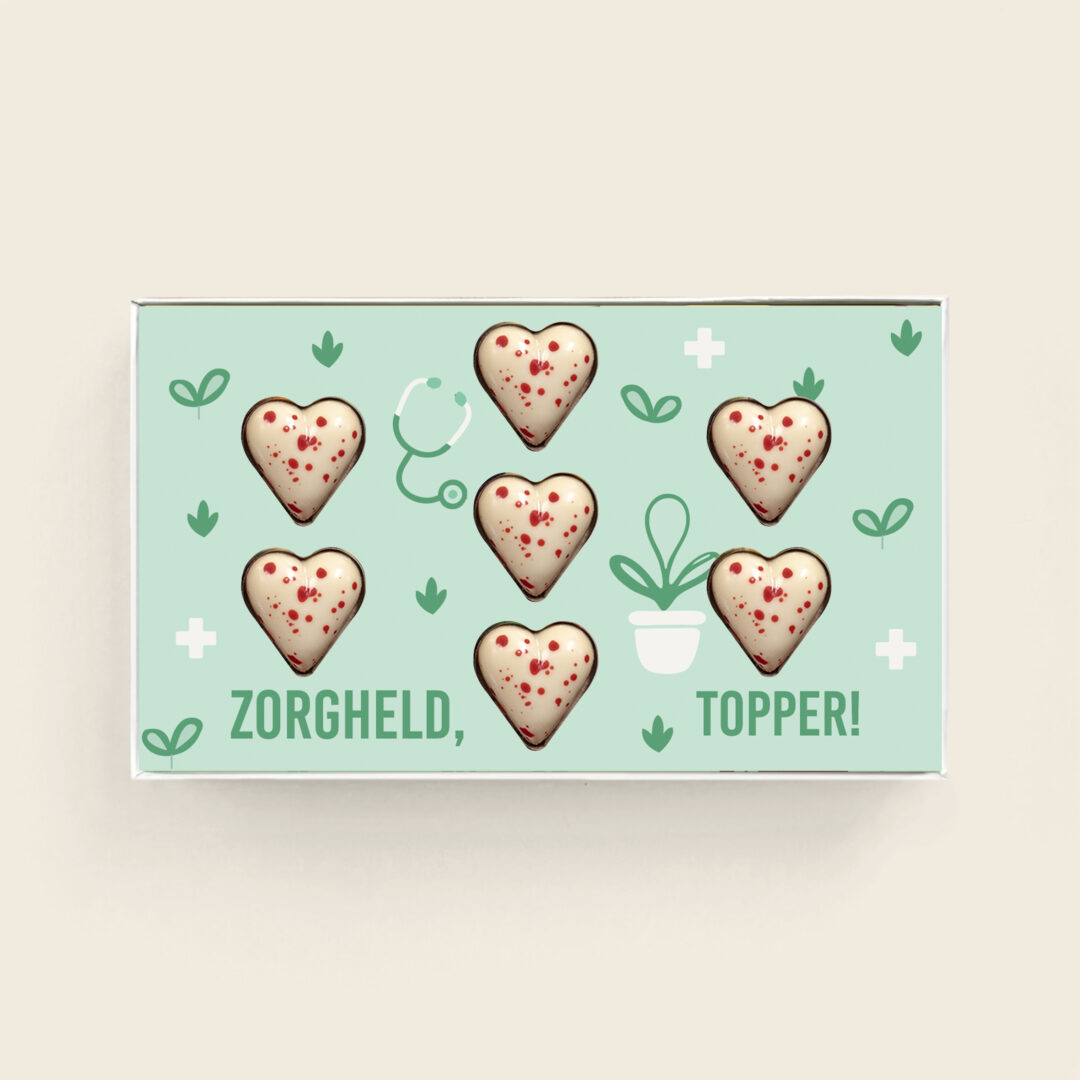 Weiße Herzen mit roten Punkten Pralinen mit köstlicher Füllung zum Thema „Tag der Pflege“ Pflegeheld-Topper. Tasty Present – personalisierte Schokolade